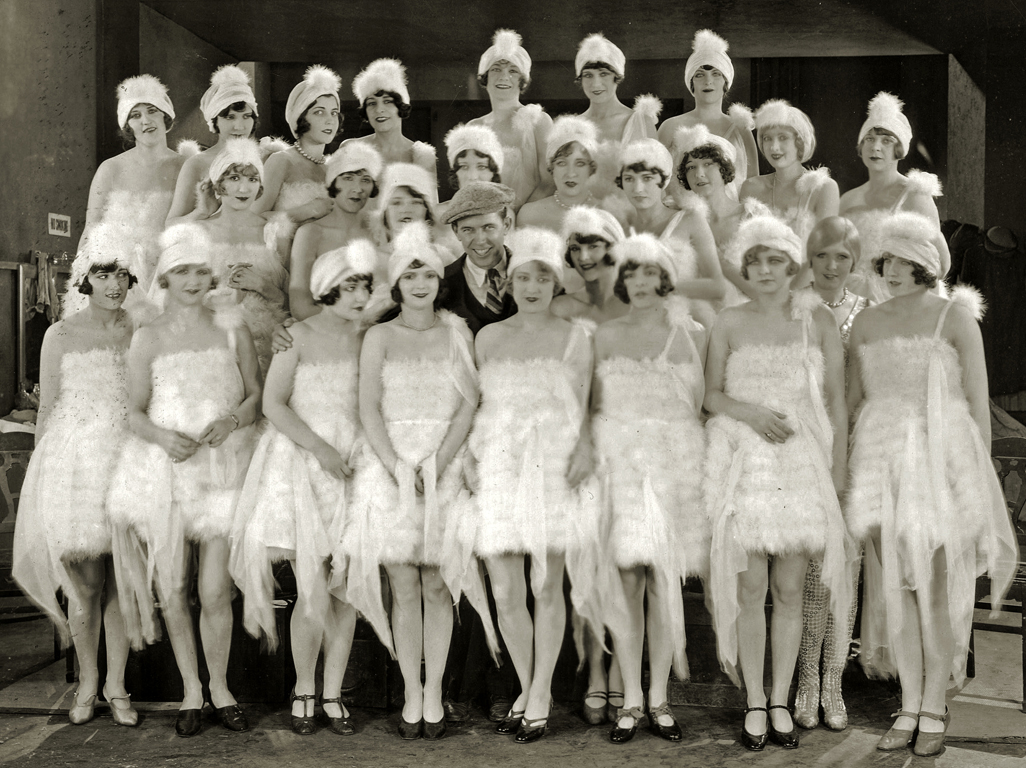 1925. 'Pretty Ladies' publicity with director Monta Bell, and Lucille LeSueur right behind his hat!