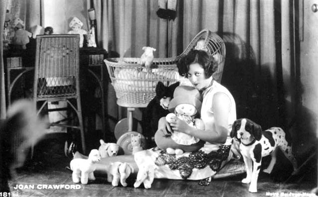 At home with her dolls, circa 1929.