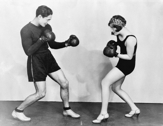 1927. Working out with trainer (later actor) Gene Alsace.