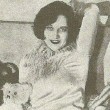 At home with dolls, appearing in a 1927 'Picture Play' magazine.