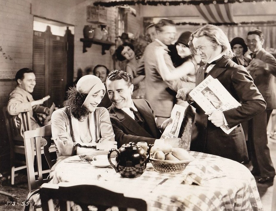 1928. 'Four Walls.' With John Gilbert, left.