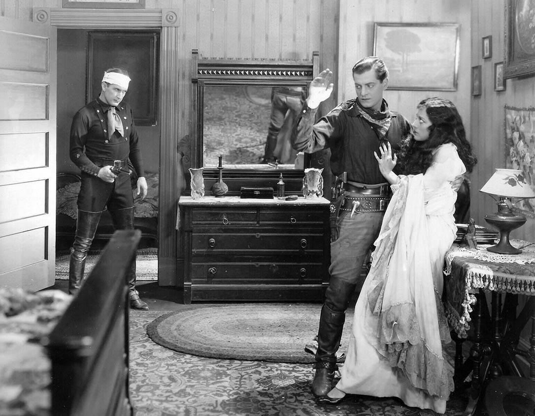 1928. 'Law of the Range.' With Tim McCoy, left, and Rex Lease.