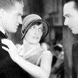 1929. 'The Duke Steps Out.' With William Haines, right.