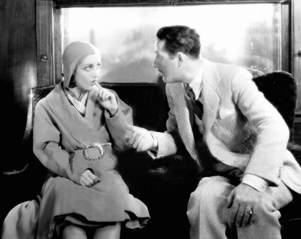 1930. A film still from 'Great Day!' with John Miljan.