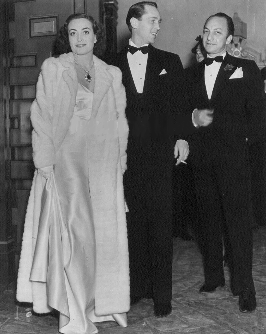 1936. With husband Franchot Tone and Jerry Asher.