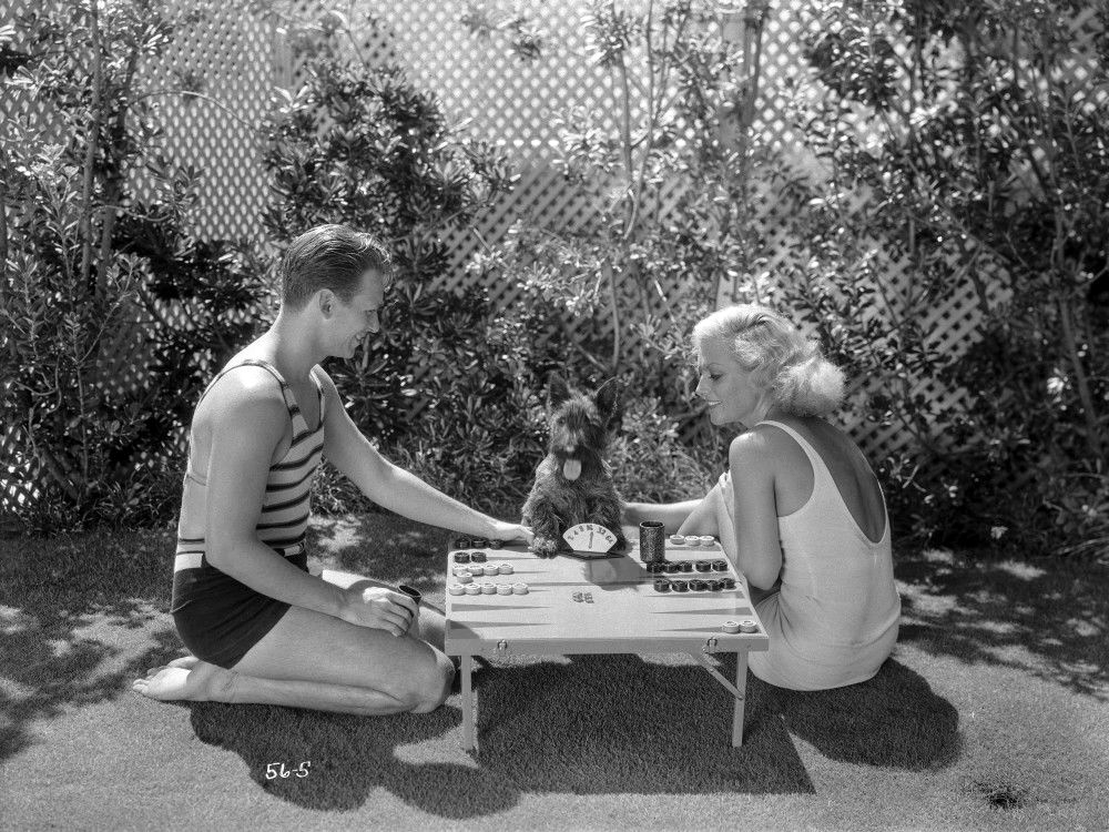 July 1931. With husband Doug Jr. and pup. Shot by Irving Lippmann.