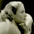 1931 publicity shot by Clarence Sinclair Bull, plus same shot with description from a magazine.
