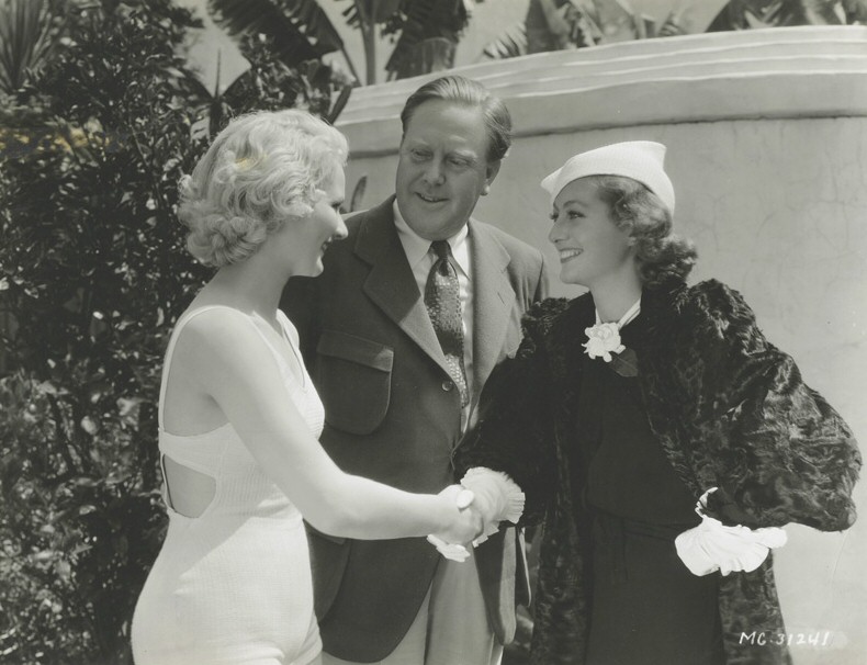 1933. With director Robert Z. Leonard and Anita Thomas of Dallas, who won a bit part in 'Dancing Lady.'