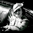 1932. In her Cadillac Fleetwood.