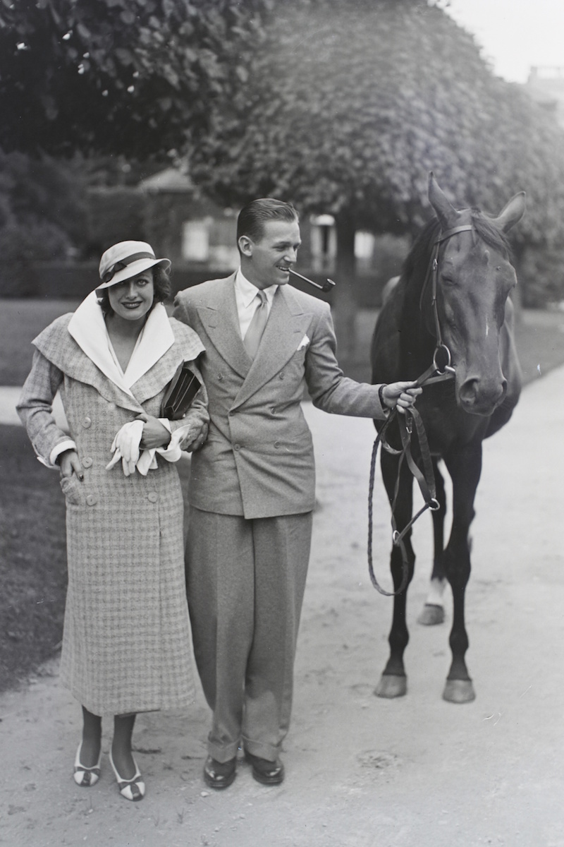 1932. With husband Douglas Fairbanks, Jr., in Chantilly, France.