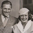 July 1932 in London's Waterloo Station. (Includes press caption announcing their divorce.)