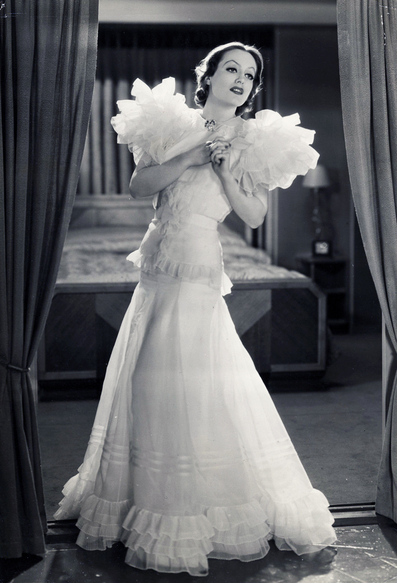 1932. 'Letty Lynton' publicity, with dress by Adrian.