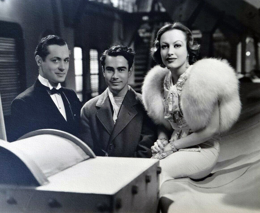 1932. On the set of 'Letty Lynton' with Robert Montgomery, left, and unknown.
