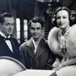 On the set of 'Letty Lynton.' With Robert Montgomery, left, and unknown.