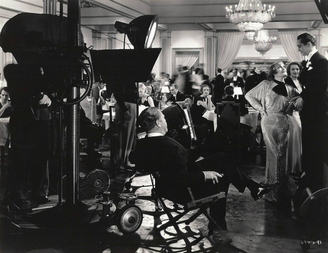 1933. Filming 'Dancing Lady' with director Leonard and Franchot Tone.