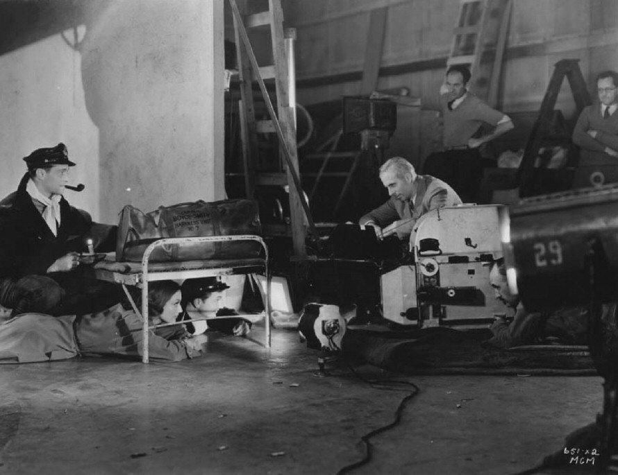 1933. On the set of 'Today We Live' with director Howard Hawks.