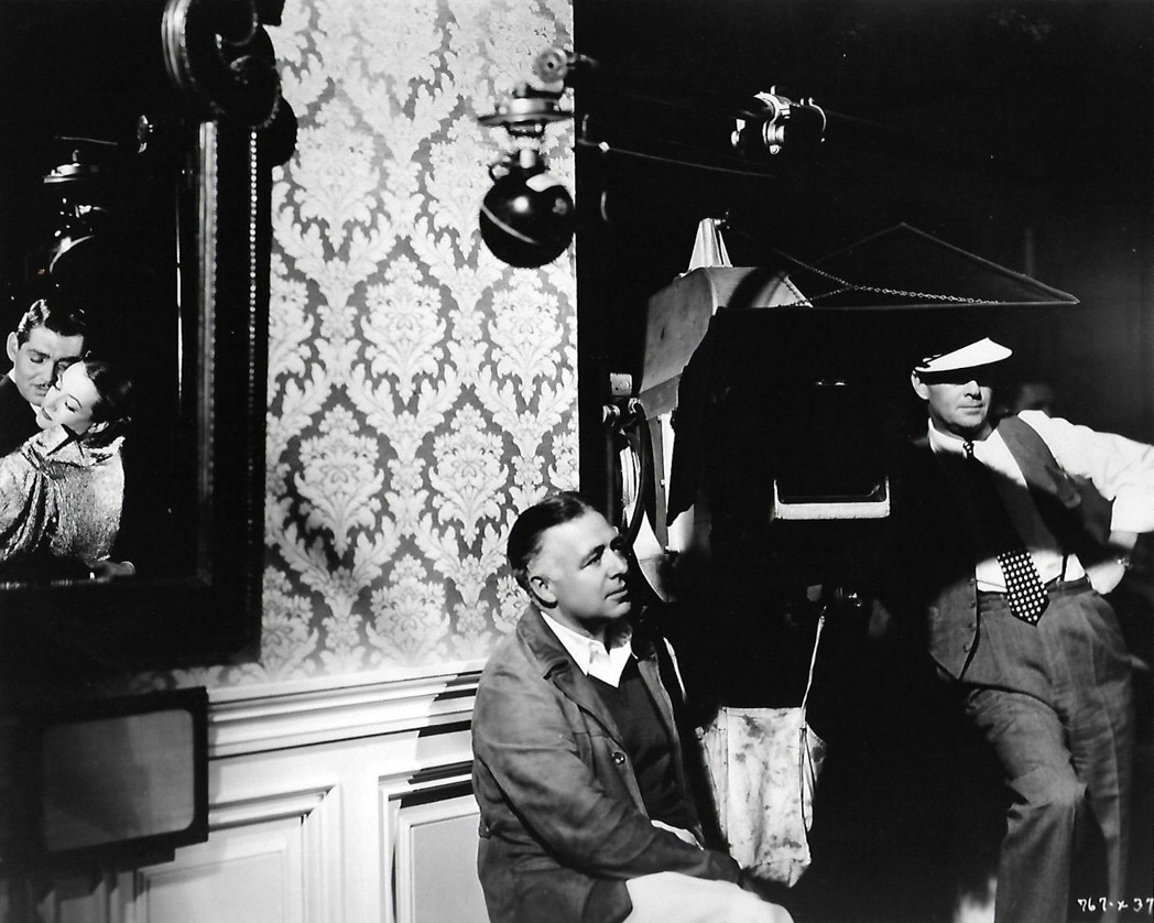 1934. Director Clarence Brown filming 'Chained.'