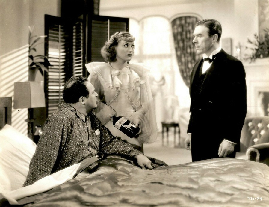 1934. 'Sadie McKee.' With Edward Arnold, left.