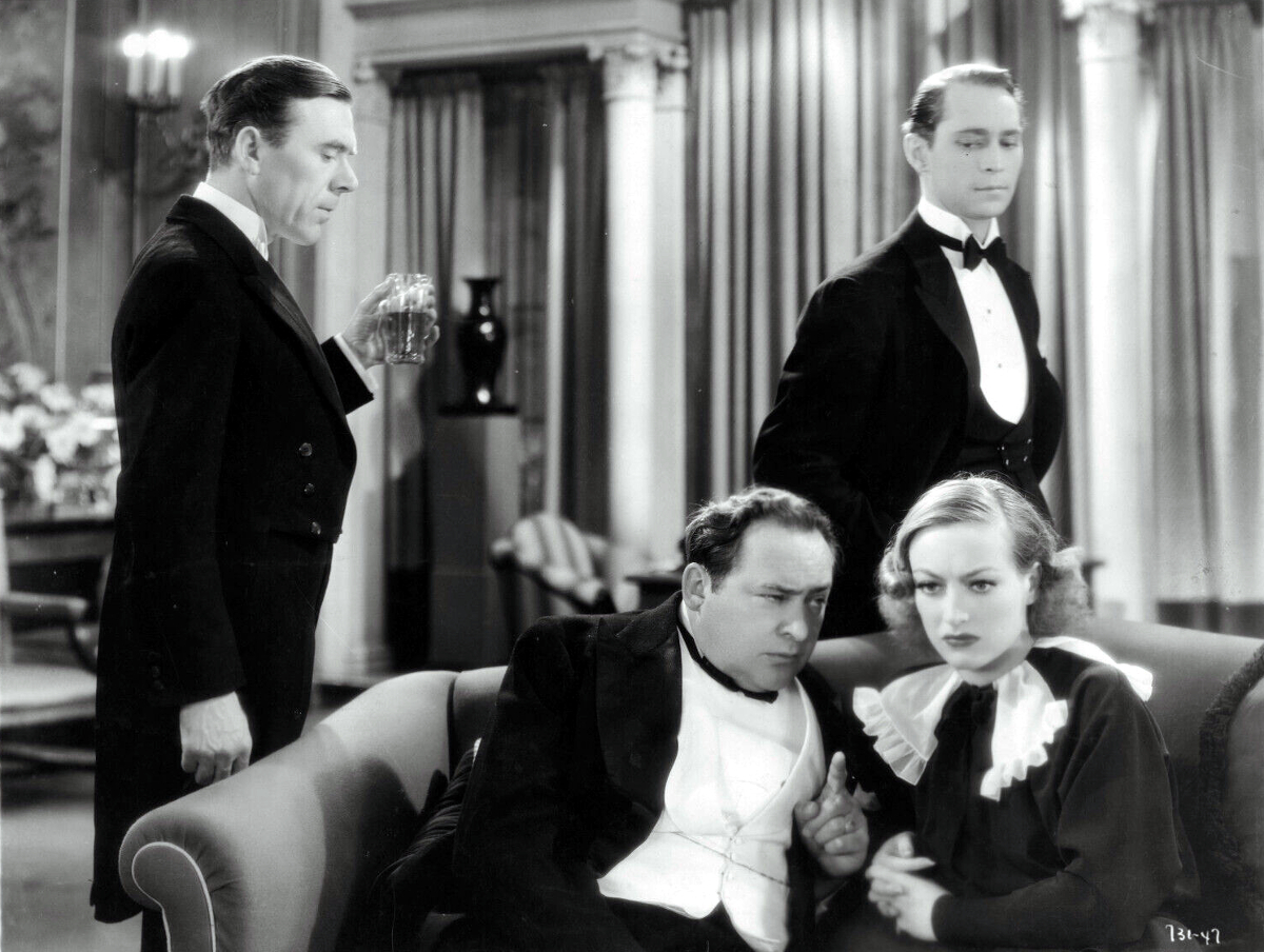 1934. 'Sadie McKee' film still with Edward Arnold (center) and Franchot Tone (right).