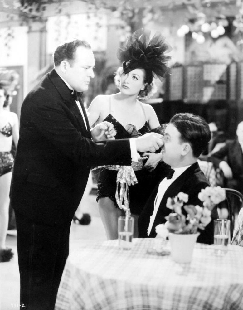 1934. 'Sadie McKee.' With Edward Arnold (left).