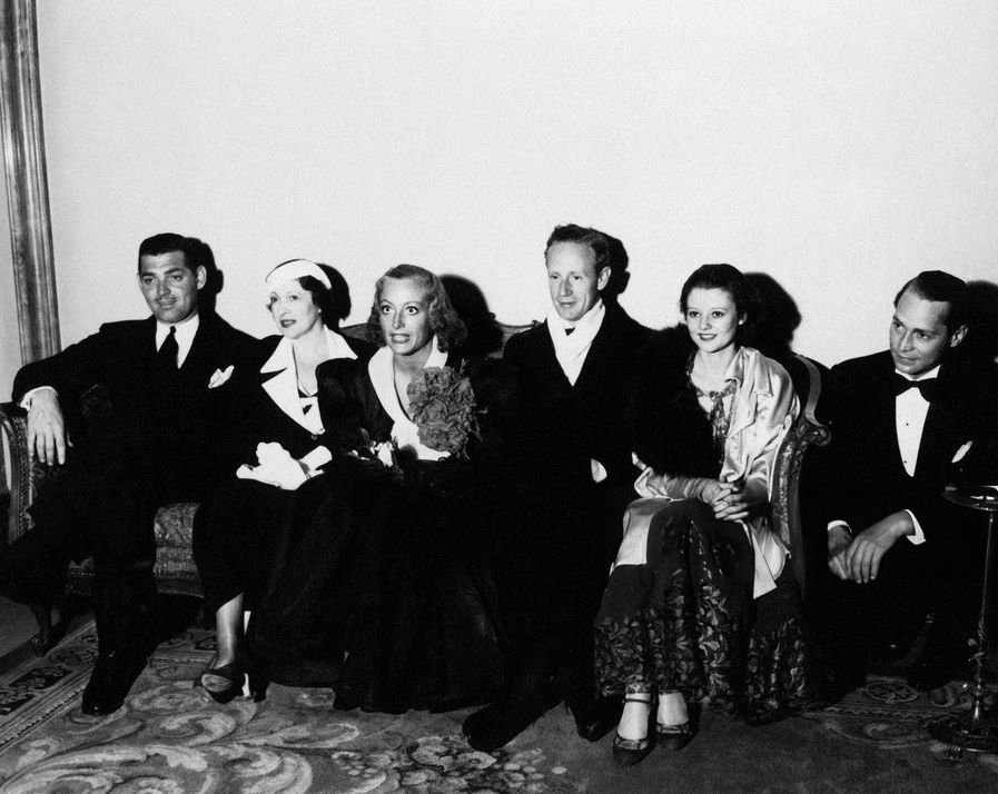 1933. At unknown event with Gable, his wife Ria, Leslie Howard, Heather Angel, and Franchot Tone.