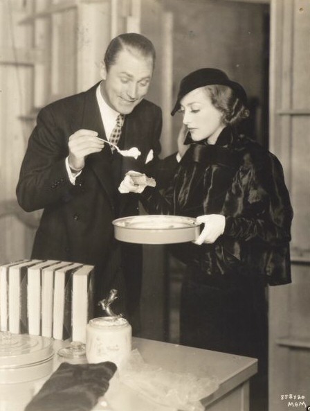 1935. On the set of 'I Live My Life' with Brian Aherne.