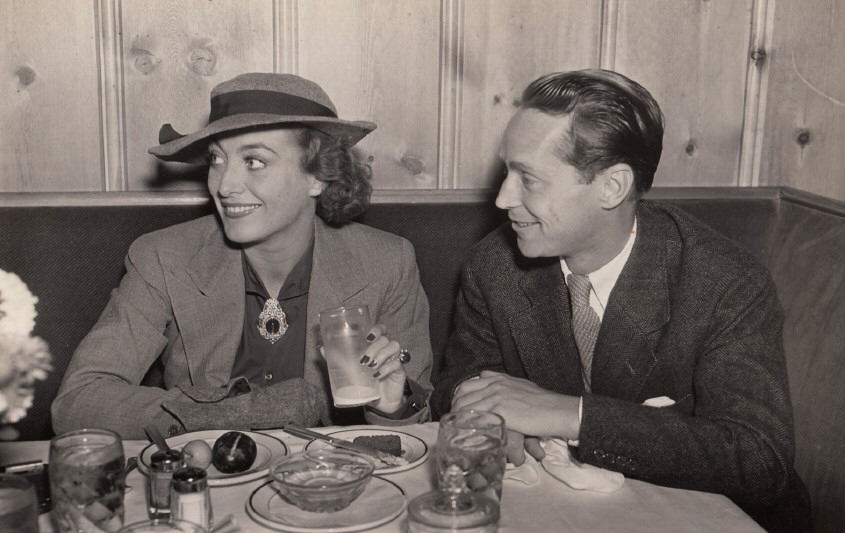 December 1935. At Hollywood's Vendome Cafe with Franchot Tone. Shot by Hyman Fink.