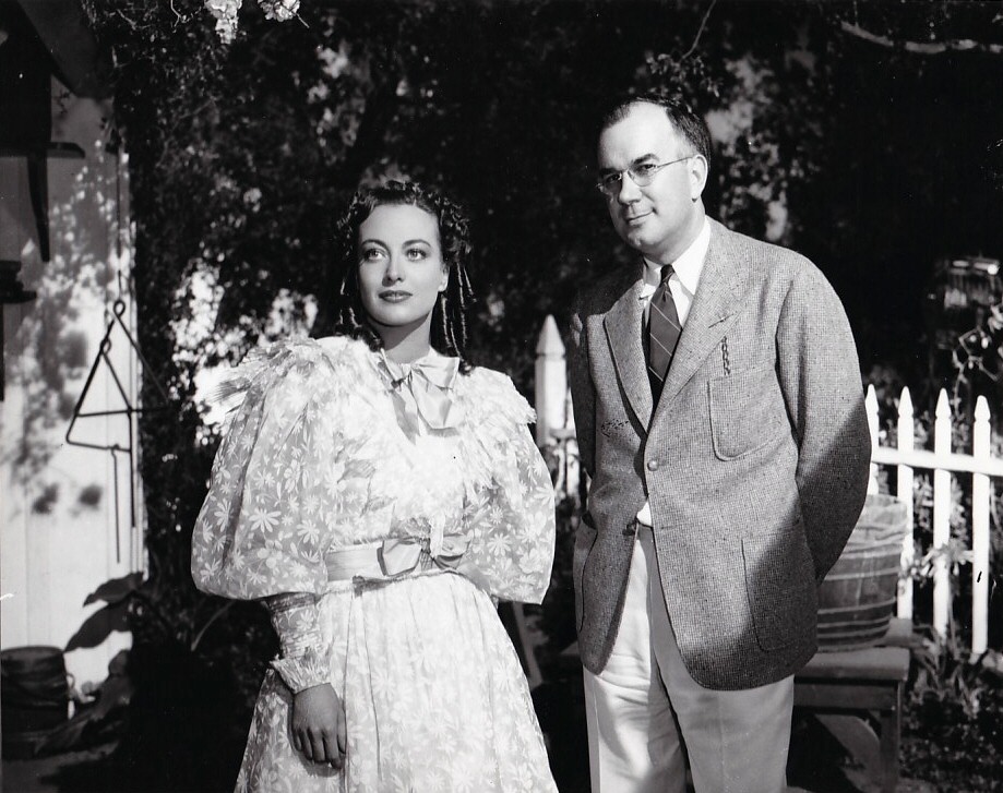 1936. On the set of 'The Gorgeous Hussy.' With unknown.