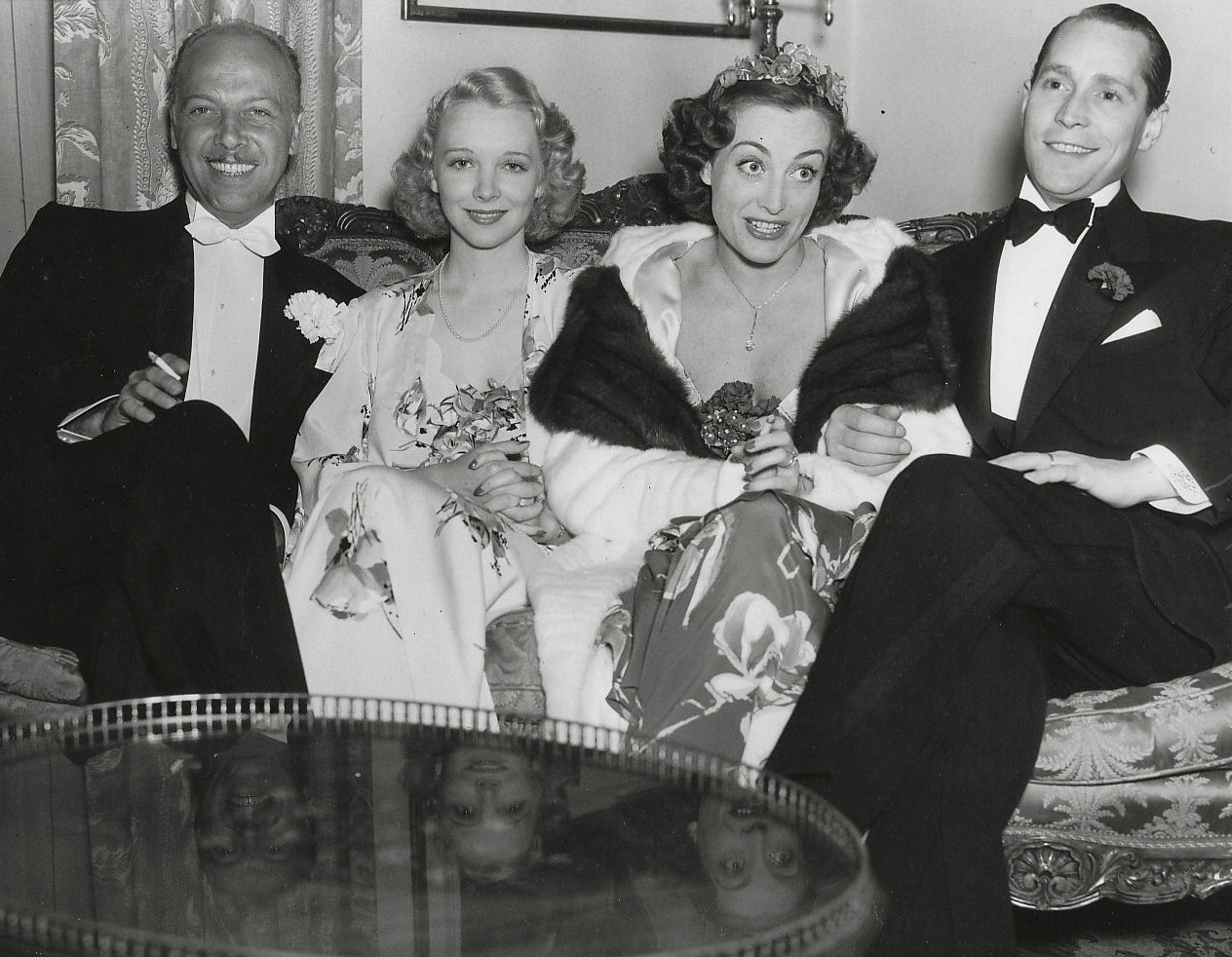 April 19, 1936. At the Beverly Wilshire Mayfair Ball, with Mitchell Leisen, Virginia Bruce, and Franchot Tone.