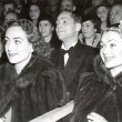 1937. With Franchot Tone and Constance Bennett at a tennis match. In furs.