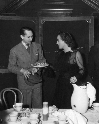 1937. On the set of 'Mrs. Cheyney' with husband Franchot Tone.