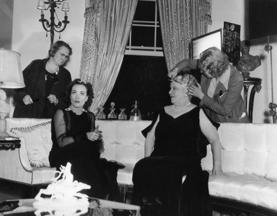 On the set of 'The Last of Mrs. Cheyney.' With Jessie Ralph.