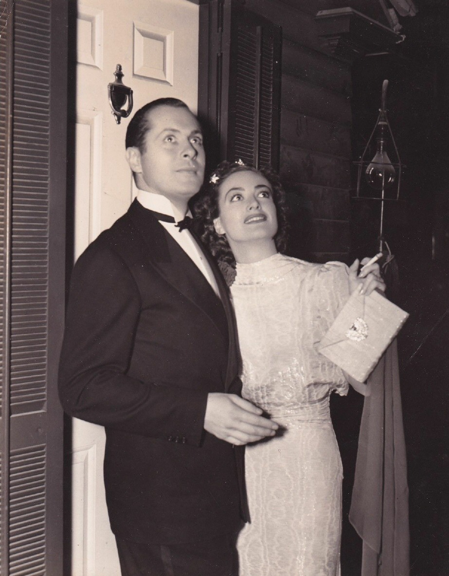 1937. On the set of 'The Last of Mrs. Cheyney' with Robert Montgomery.