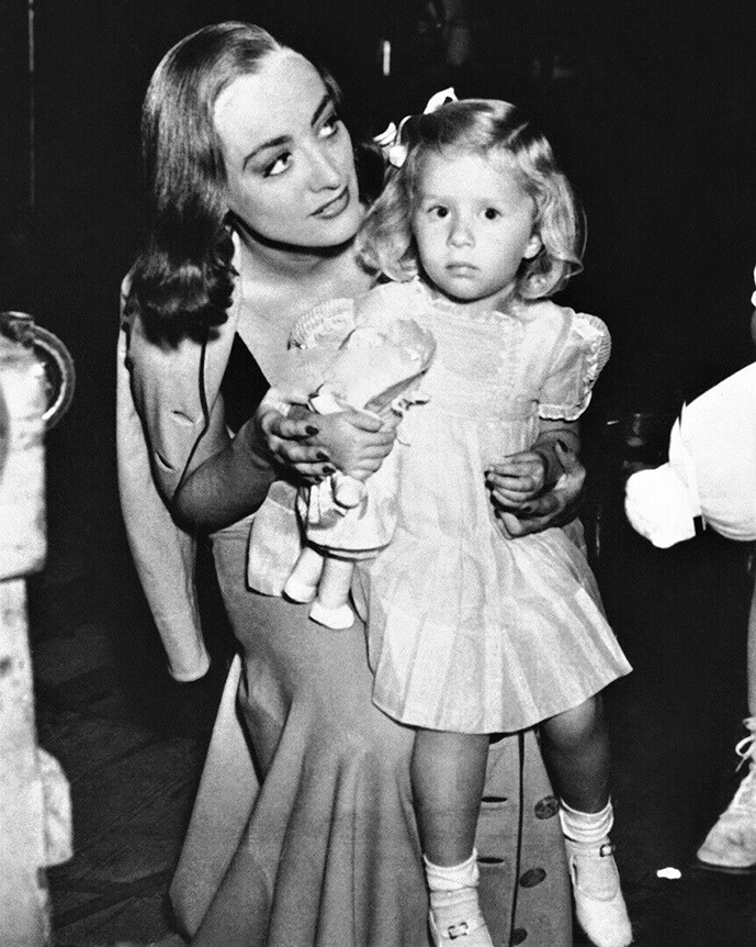 1937. On the set of 'The Bride Wore Red' with niece Joanie LeSueur.