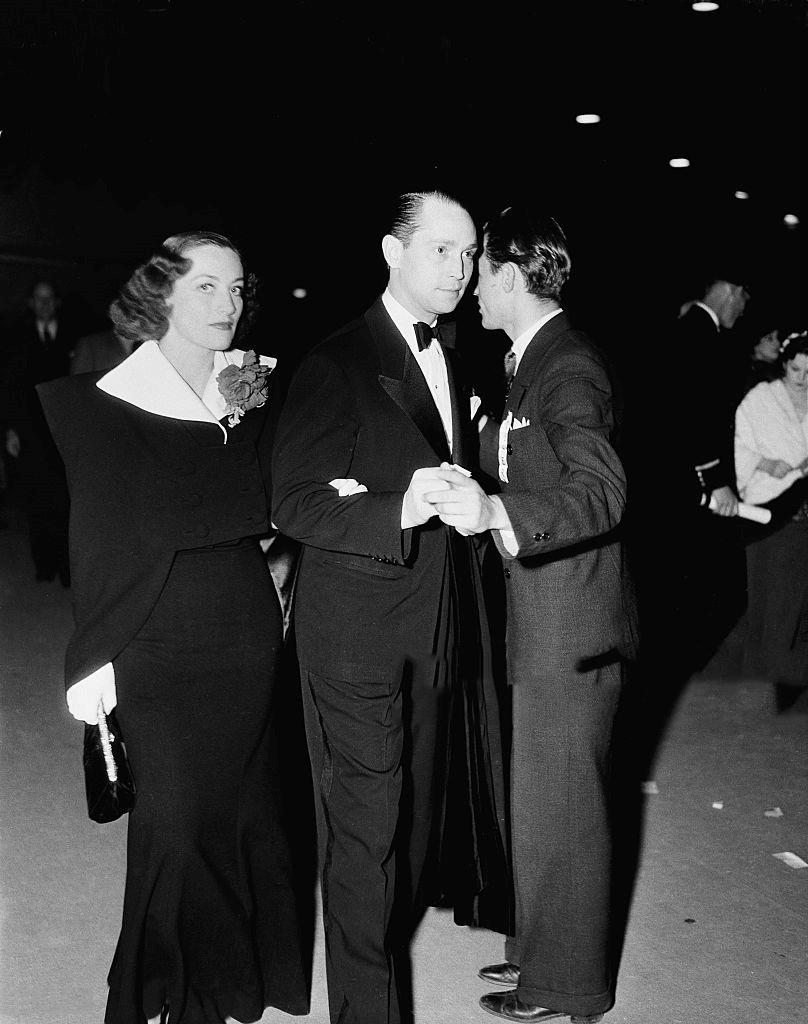 1936. With husband Franchot Tone and unknown.