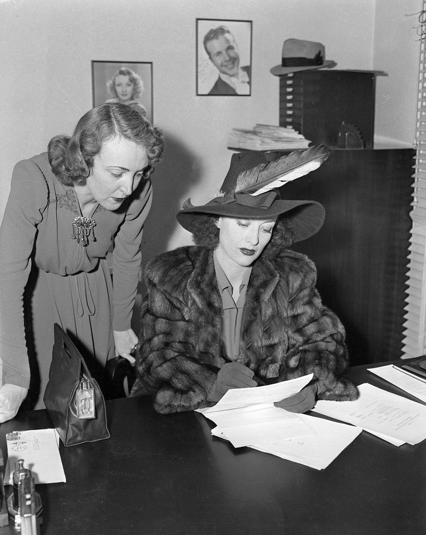 March 1939. Signing divorce papers.