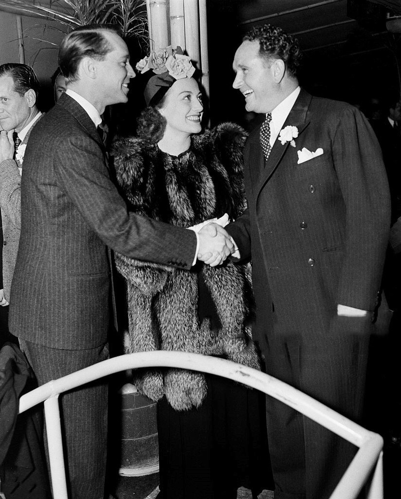 1937. With husband Franchot Tone, left, and director Frank Borzage.