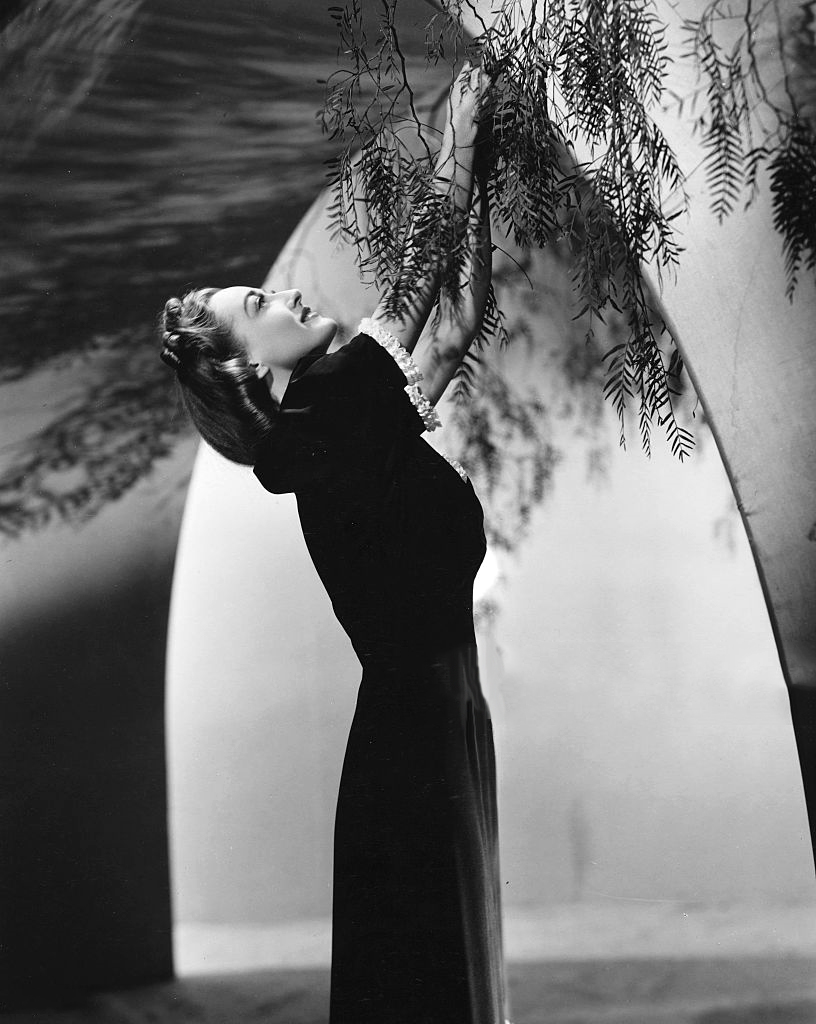 1938 publicity by Willinger, with gown by Adrian.