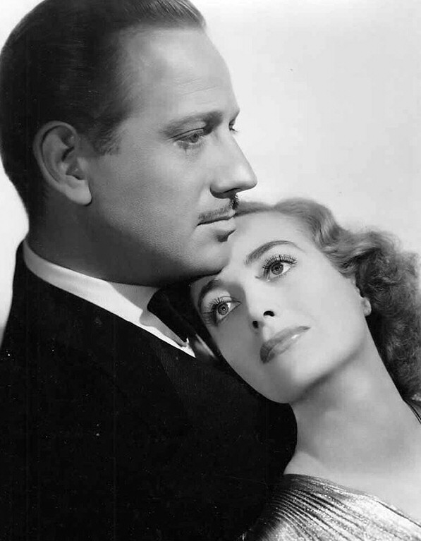 1938. 'The Shining Hour' publicity with Melvyn Douglas.