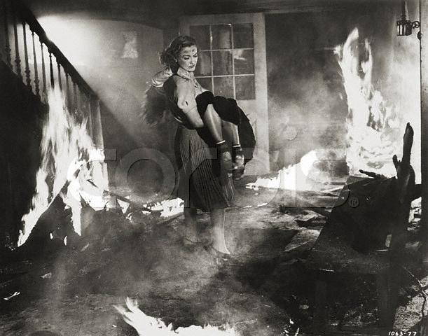 1938. Joan carries Margaret Sullavan in 'The Shining Hour.' Photo source: Corbis.