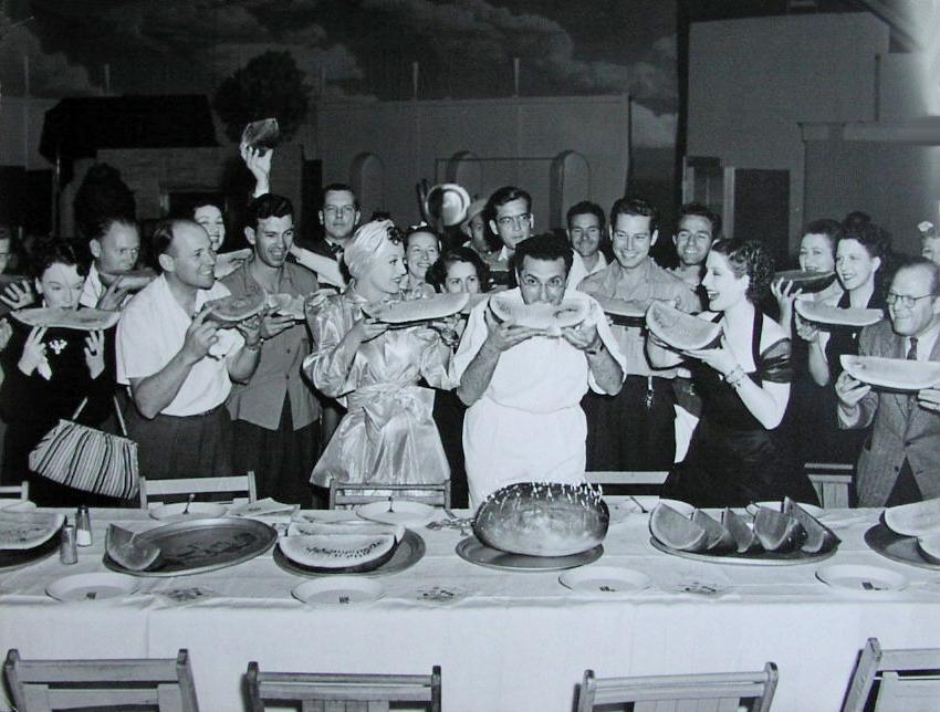 1939. On the set of 'The Women.' Director Cukor and Norma Shearer to the right of Joan.