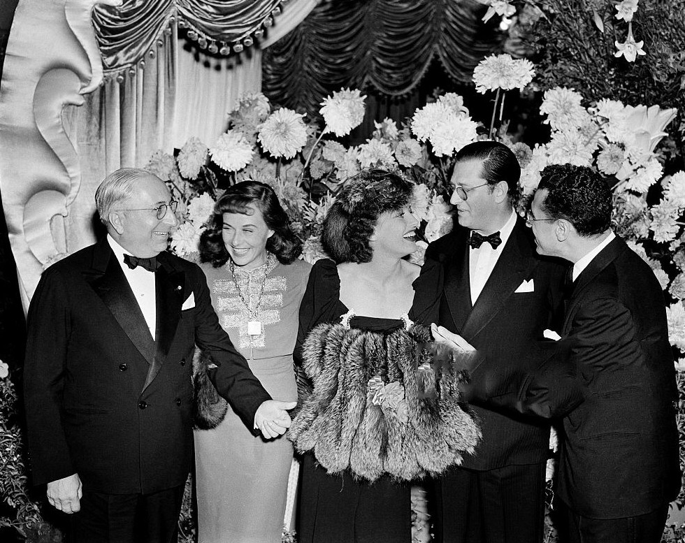 1939. At the premiere of 'The Women' with LB Mayer, Paulette Goddard, Hunt Stromberg, and George Cukor.