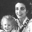 1940, with newly adopted Christina (bad kid and bad teeth!).