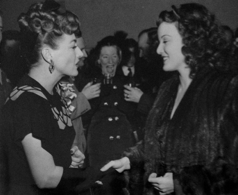 1945. At a Warners reception for Joan at NYC's Sherry-Netherland, with Nanette Fabray.