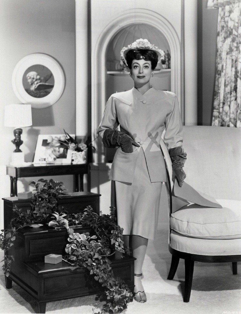 1942. Joan in her wedding suit by Irene.