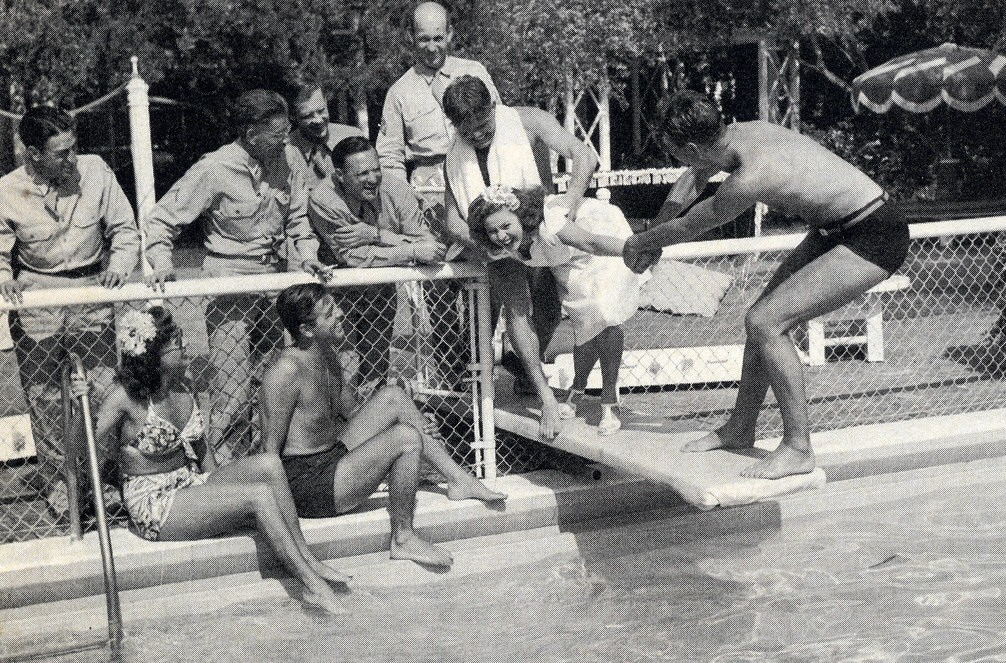 April 1945. With husband Phil Terry, servicemen, and Shirley Temple.