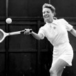 Circa 1945. Playing tennis.