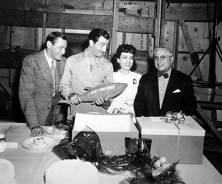 1941. On the set of 'When Ladies Meet' celebrating Robert Taylor's birthday. With Herbert Marshall, Taylor, Louis B. Mayer.