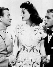 From left: John Wayne, Joan, Philip Dorn.