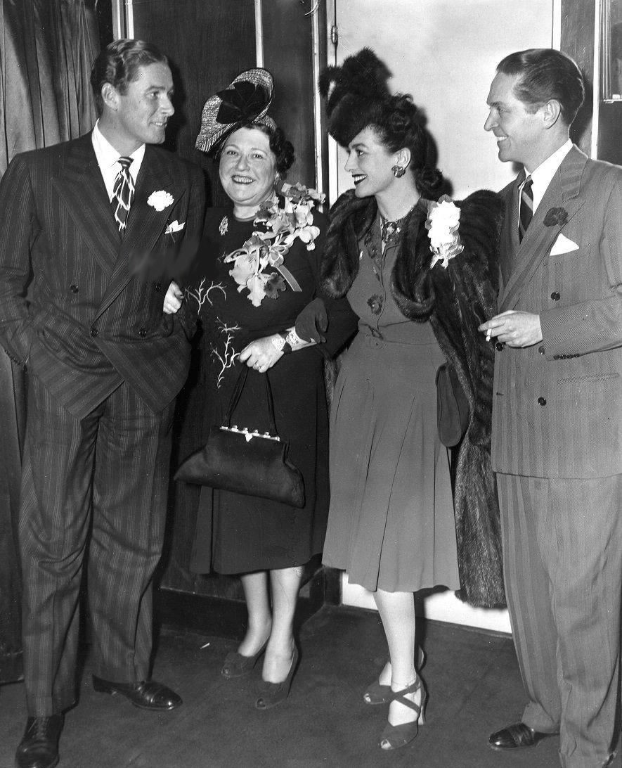 1942. At the Stork Club with Errol Flynn, left, and Louella Parsons.